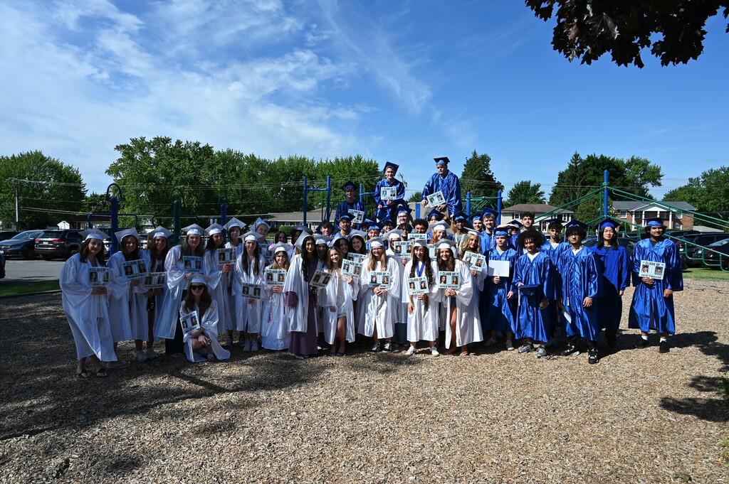 The Class of 2026 seniors from Forts Ferry pose on their old playground.