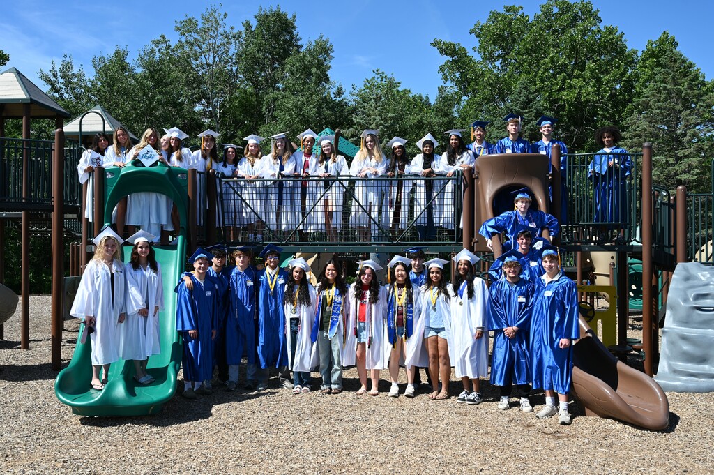 Class of 2026 members from Latham Ridge pose on their old playground.