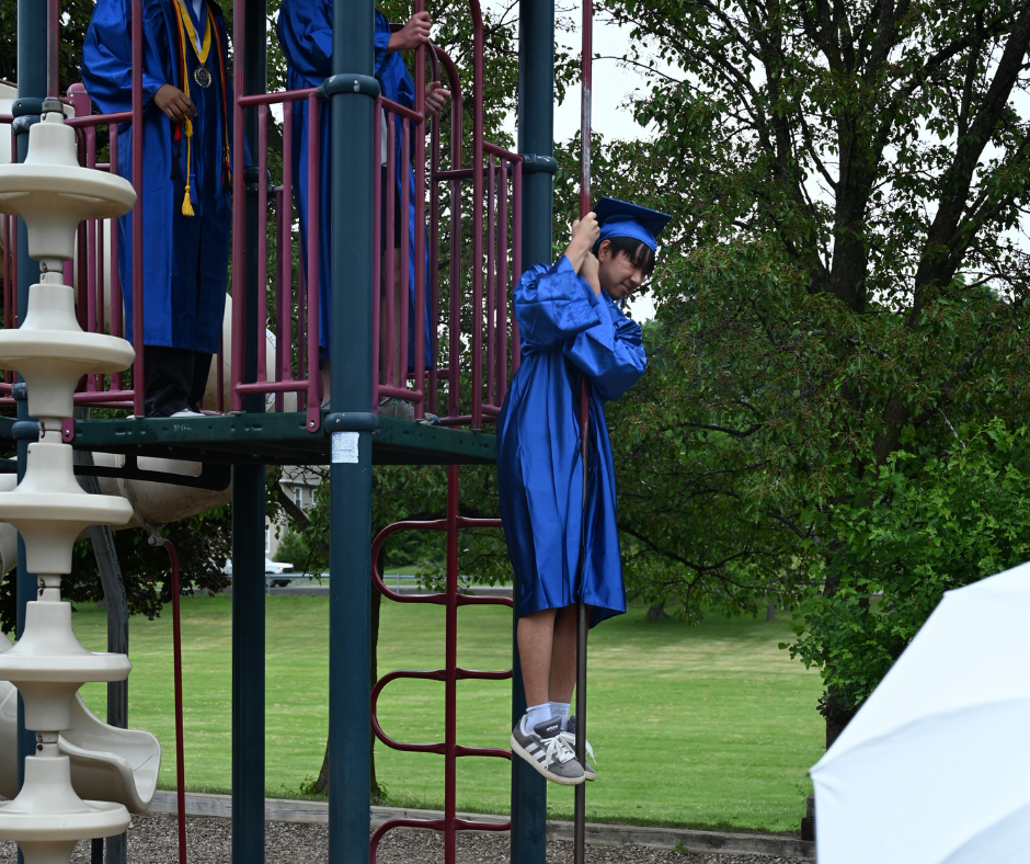 Seniors go down fireman's pole at the Boght Hills playground