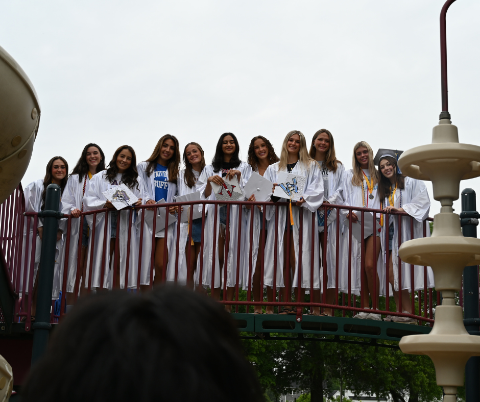 Group of seniors pose for picture on playground