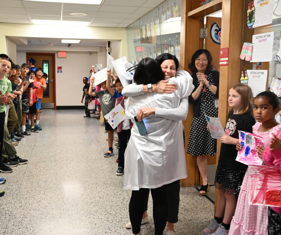 Shaker senior hugs past elementary teacher