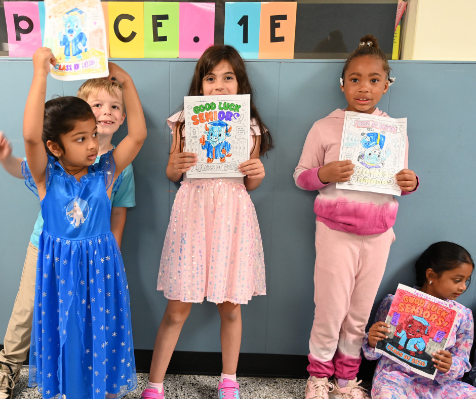 Boght Hills students pose with drawings they made for the seniors