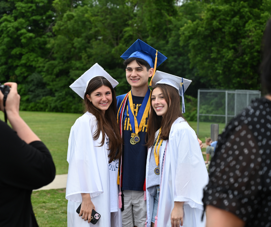 Three seniors pose for a picture