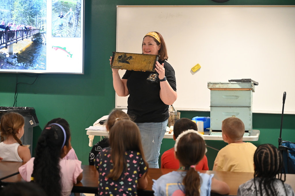 Mrs. Levitus shows off a boar with wax that came out of a beehive.