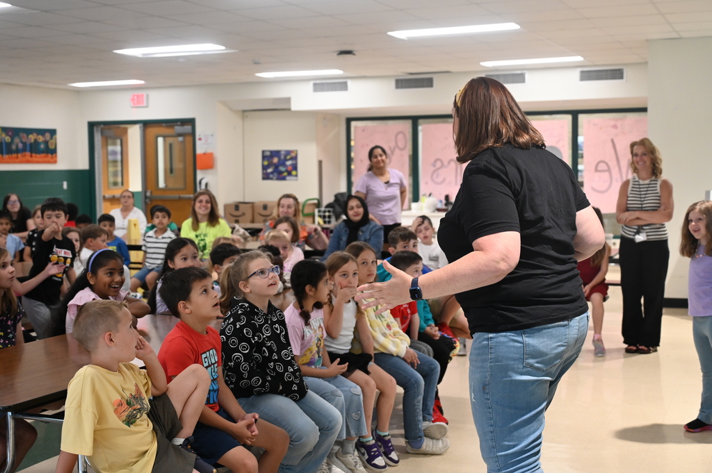 Mrs. Levitus presents to a group of first grade students.