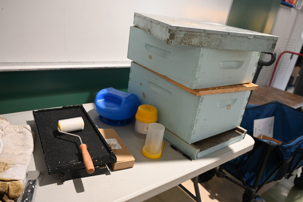 A beehive and tools used.