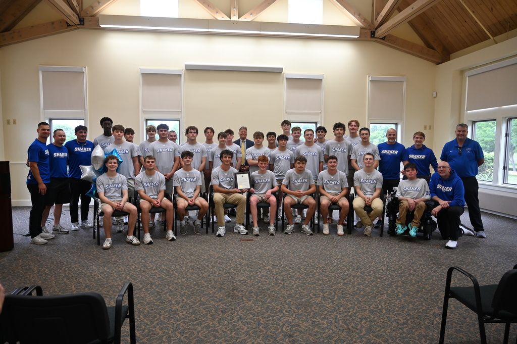 The Shaker boys lacrosse team poses with Town Supervisor Crummey.