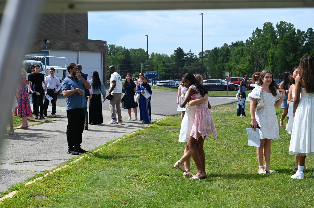 Friends hug after SMS graduation