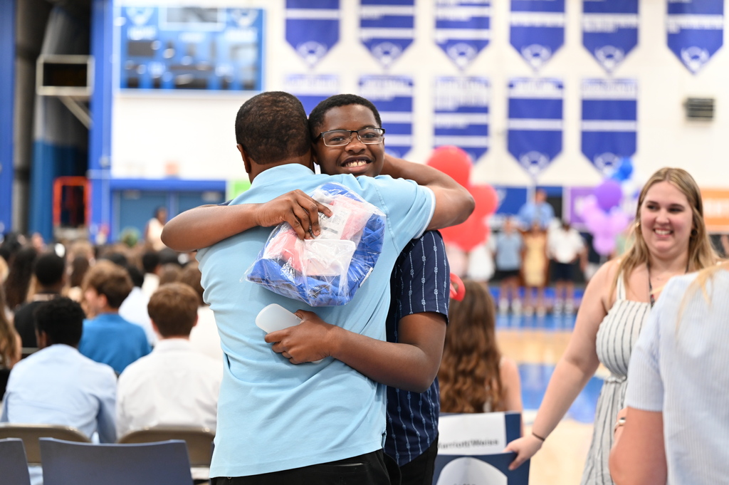 SMS student hugs teacher