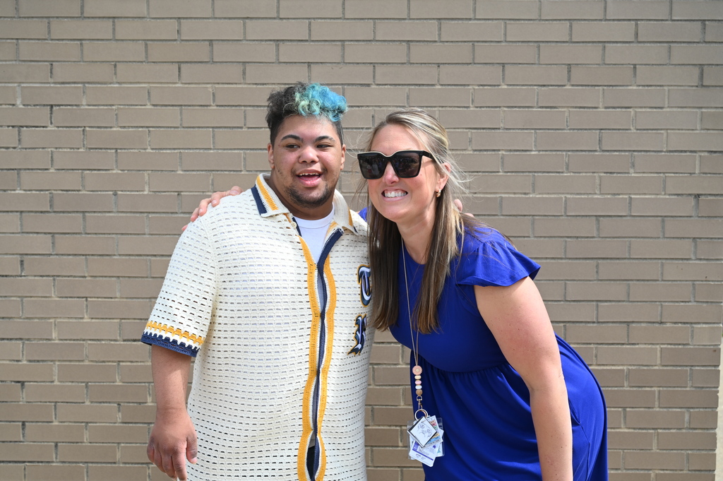 SMS graduate and teacher