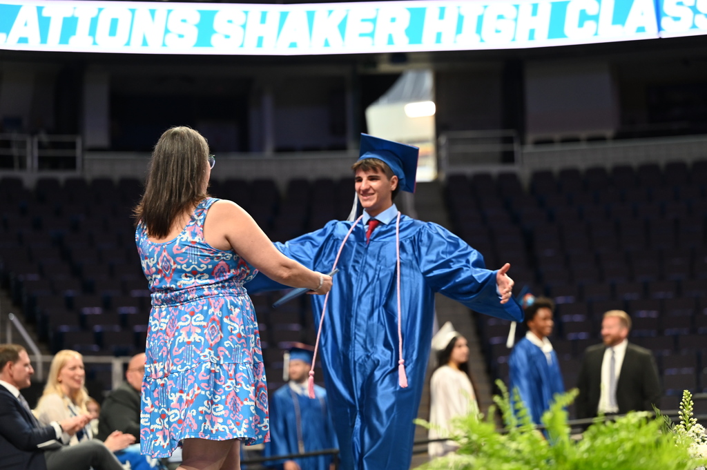 Graduate walks across stage to hug mom
