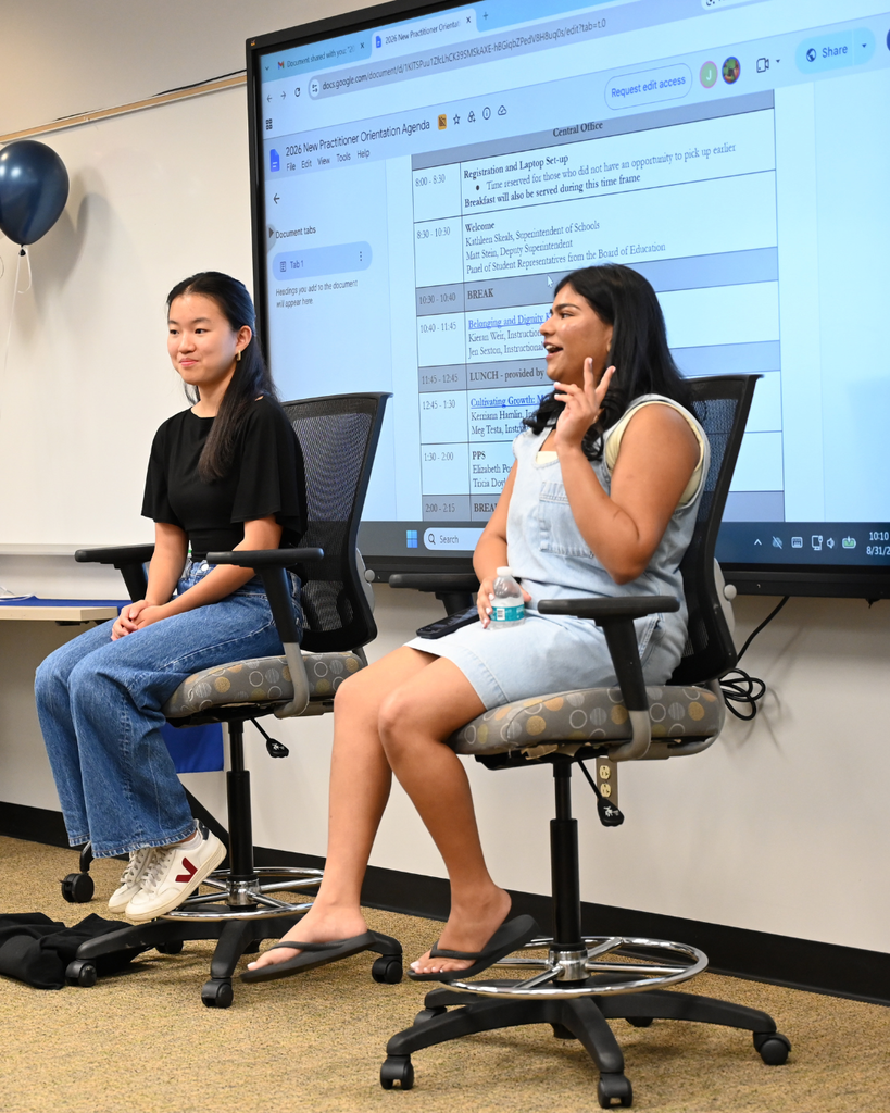 Student Board of Education members Shreya and Gianna talk to new practitioners