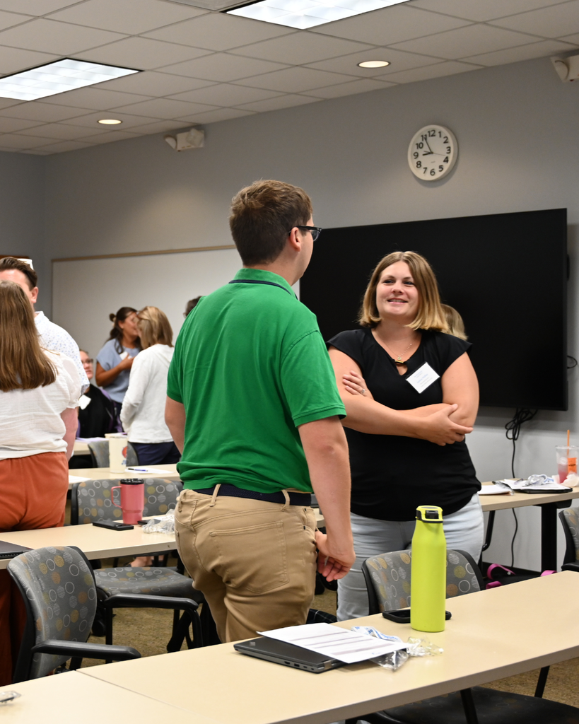 New practitioners discuss with one another