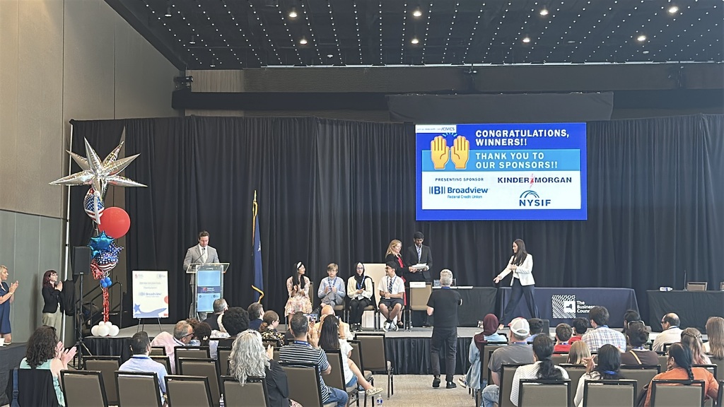 photo of national civics bee, featuring Vibhav Doppalapudi presenting to a room of people.