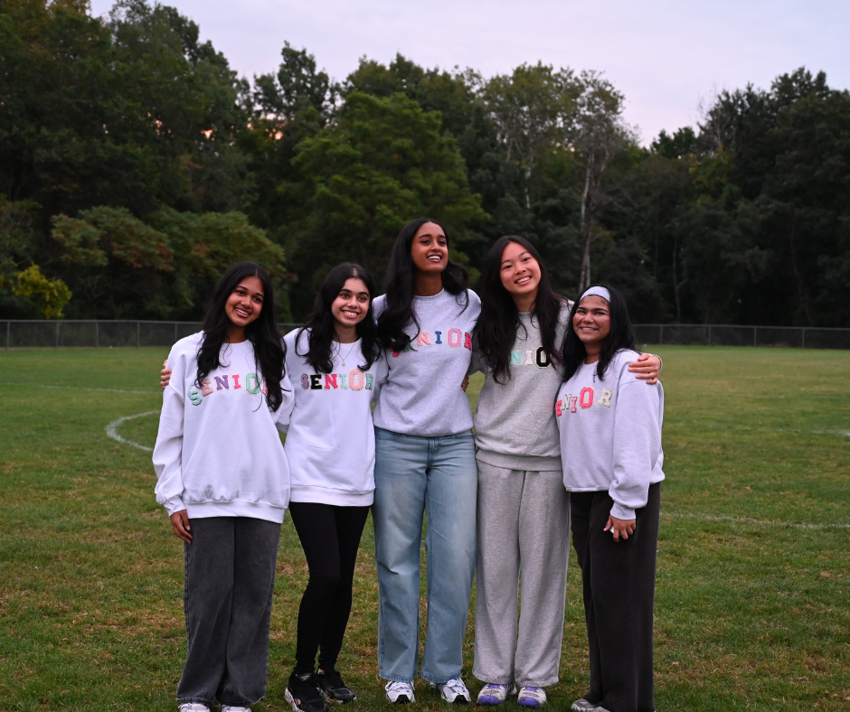 Five seniors in front of the sunrise
