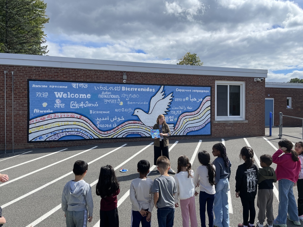 teacher reading to a group of students