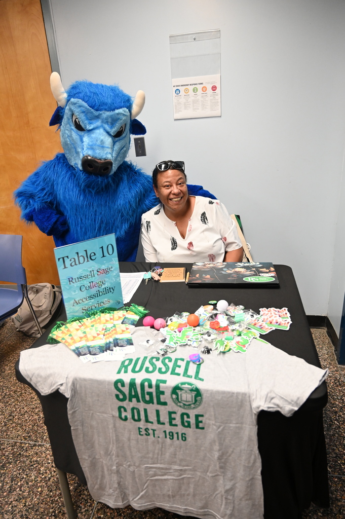 russell sage vendor posing with the bison smiling