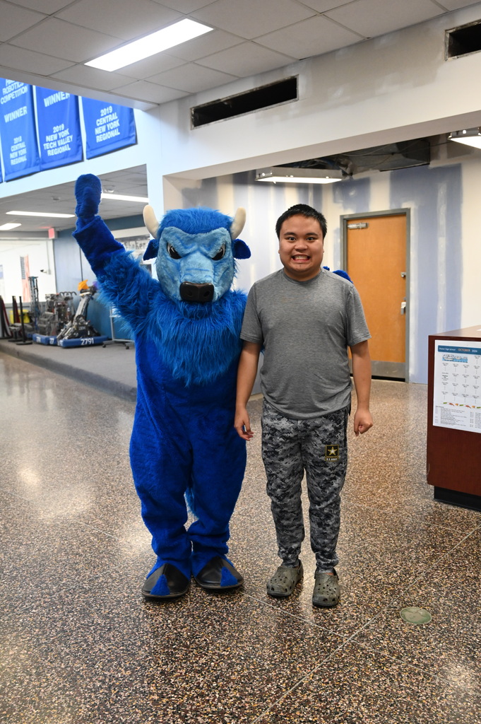 nathan standing with the bison