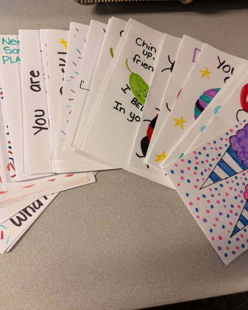 An image of the handmade cards, made by Mia, fanned out on a table.