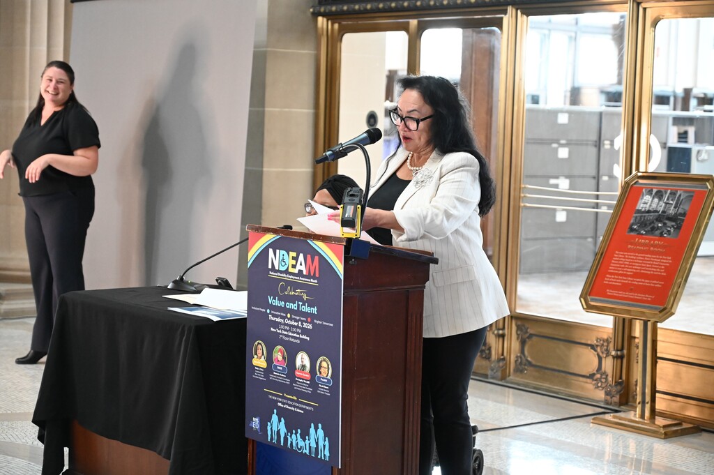 NYSED Commissioner Betty Rosa delivers remarks from behind the podium.