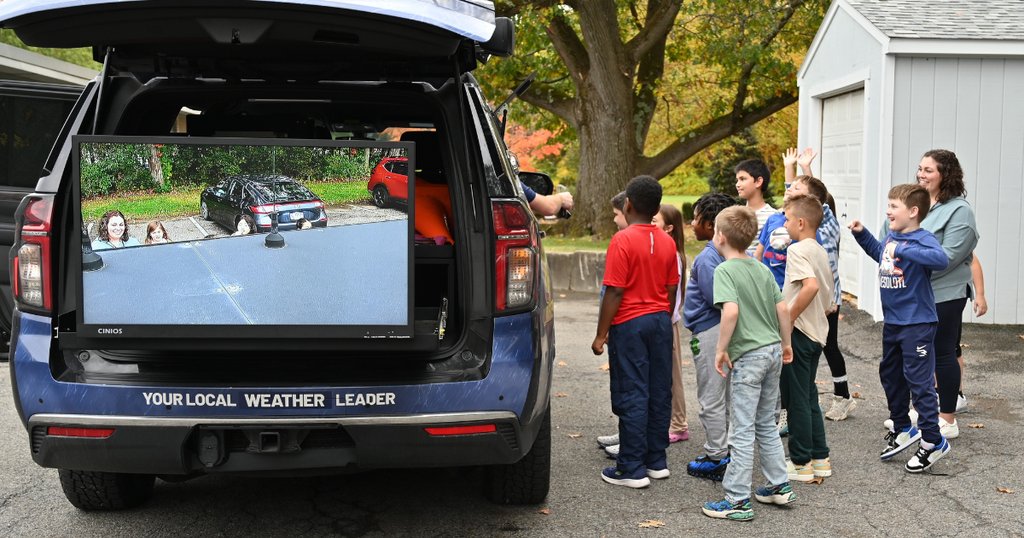 Students looking at the WTEN Storm Tracker