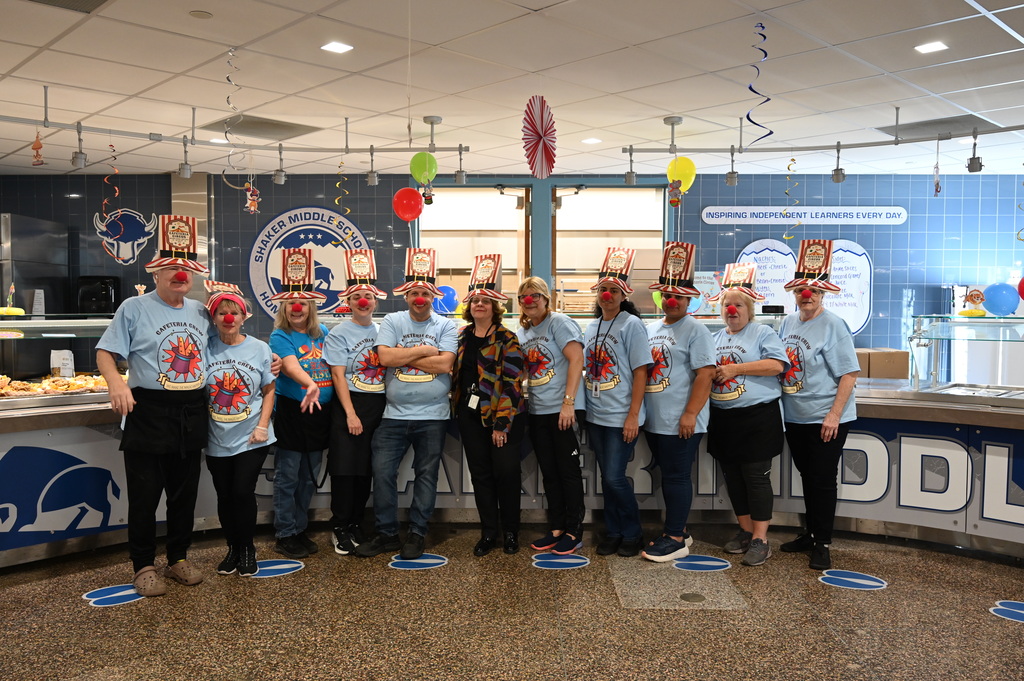 Shaker Middle School Cafeteria Crew wearing clown noses and circus hats