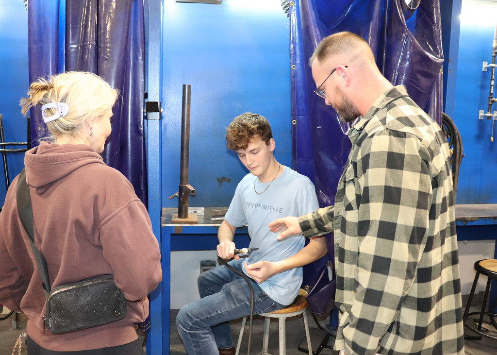Capital Region BOCES senior Tyler Jourdanais shows welding equipment to his parents Theresa and Floyd Jourdanais during an open house Thursday at the Career and Technical Education  (CTE) Center - Albany Campus