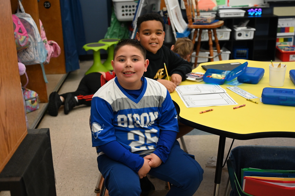 students smiling at the camera