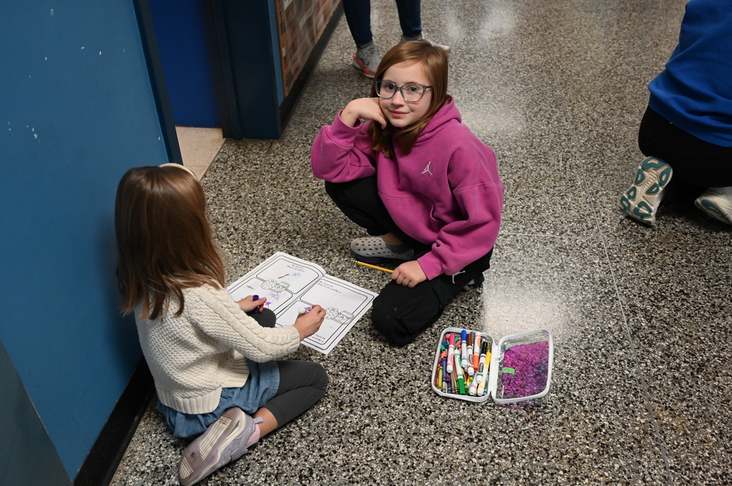 student smiling in the hallway