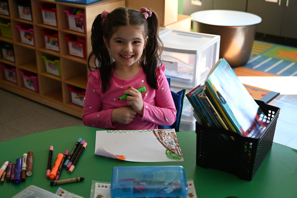student smiling at the camera