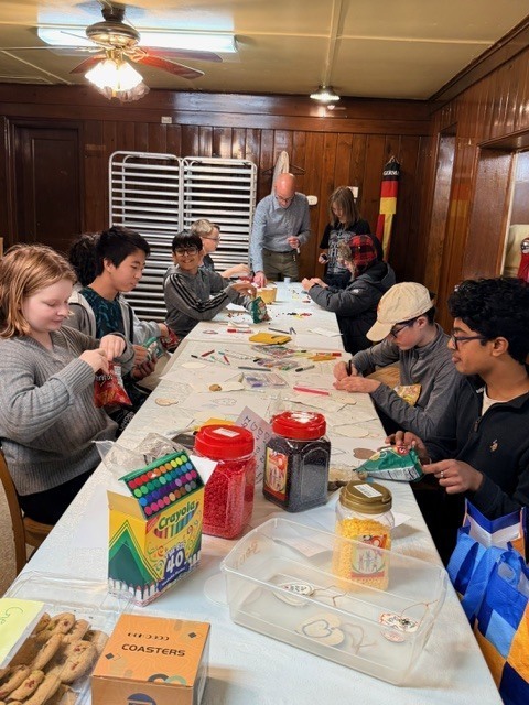 group of students doing arts and crafts with a teacher
