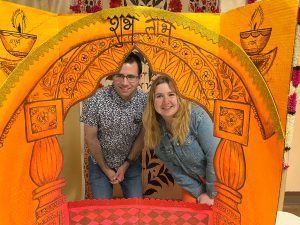 Two teachers pose together at the Guru Vandana ceremony honoring them.