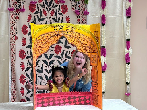 A teacher and student smile big for the camera at the Guru Vandana ceremony.