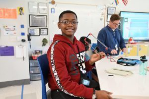 A student shows off his in progress class assignment in Simulation innovation lab.