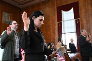 North Colonie food service worker Marianna Kilinkarova Zahopoulos takes the oath for citizenship.