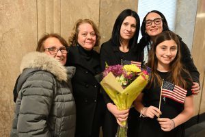 Marianna Kilinkarova Zahopoulos is joined by her daughter and North Colonie colleagues to celebrate her new U.S. citizenship.