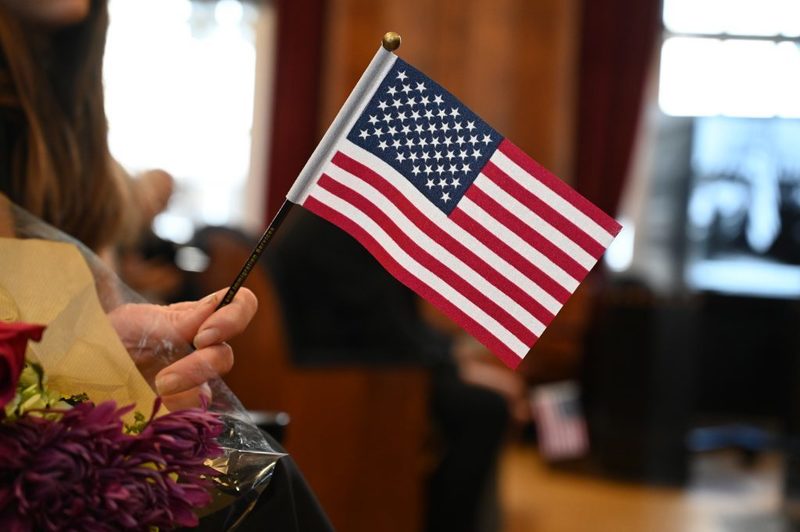 Each new U.S. citizen received a small American flag.