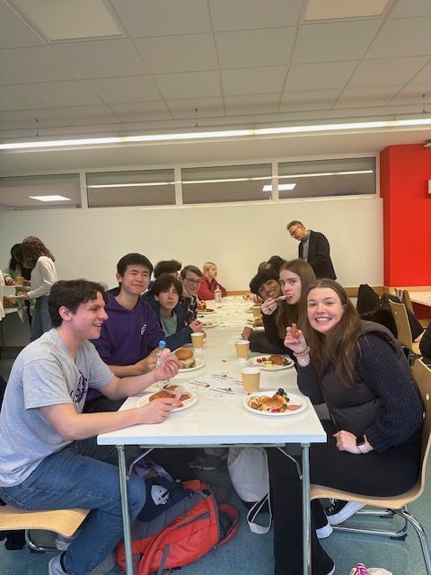 Students enjoy a meal together during their exchange program trip in February.