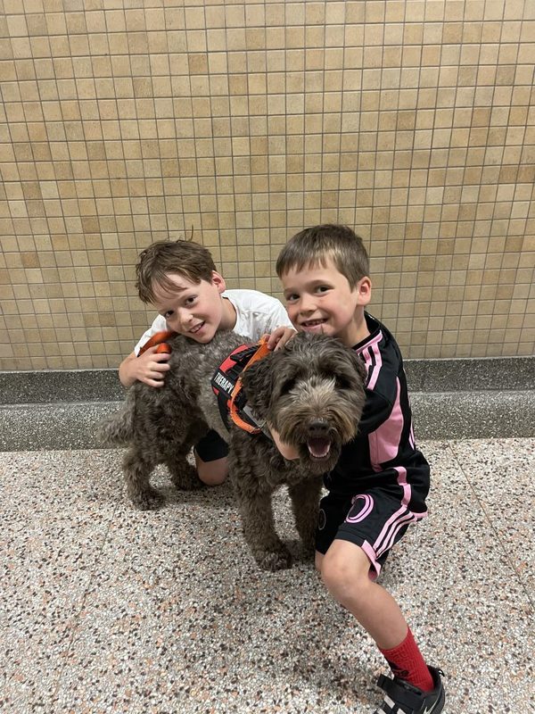 Therapy dog with students 