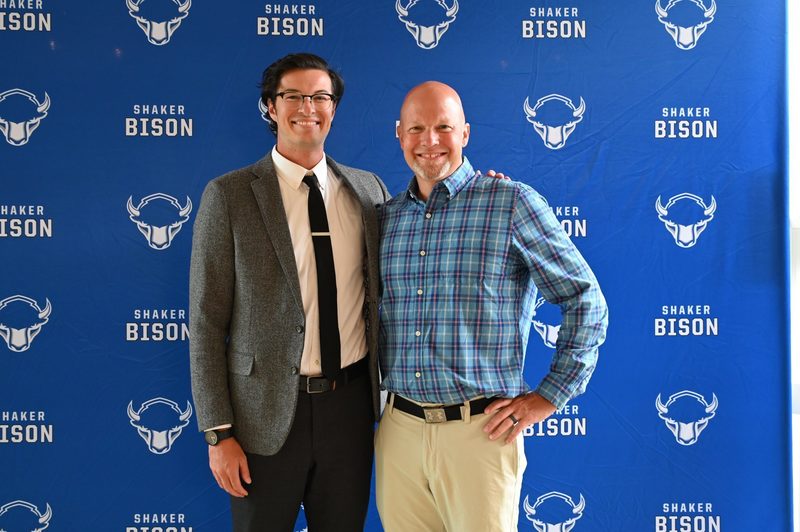 Class of 2024 Shaker Athletic Hall of Fame inductee James Steck celebrates with track and field coach Dave Stadtlander at the induction ceremony.