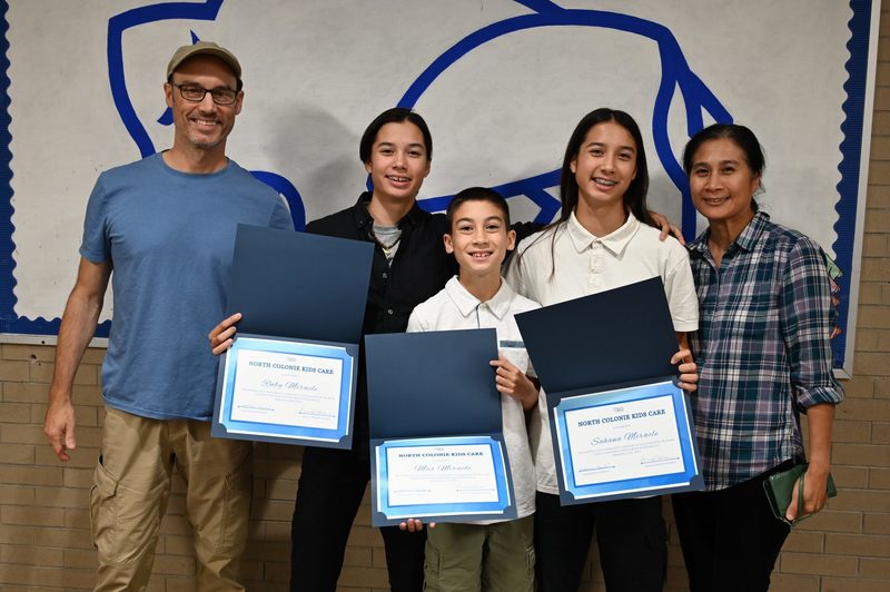 The Miracle family celebrates Max, Sahana and Ruby’s Kids Care honor.