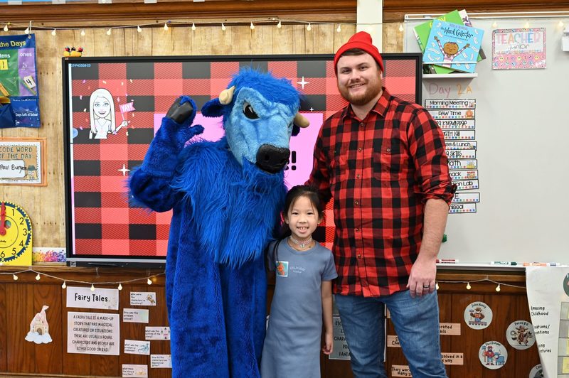 Paul Bunyan and Babe the Ox pose with a new friend.