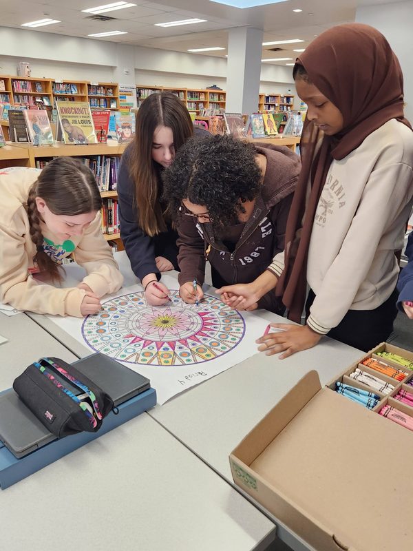 Students work together to create a beautiful mandala.