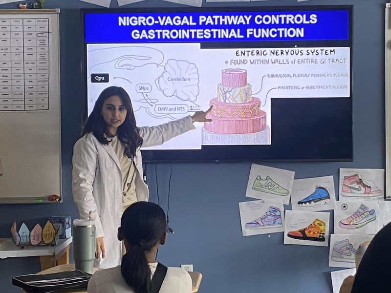 NCCSD alumna Dr. Kainat Akhtar shares her Parkinson’s research with seventh grade students.