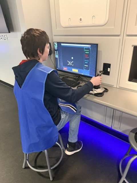 student using a computer to solve a problem