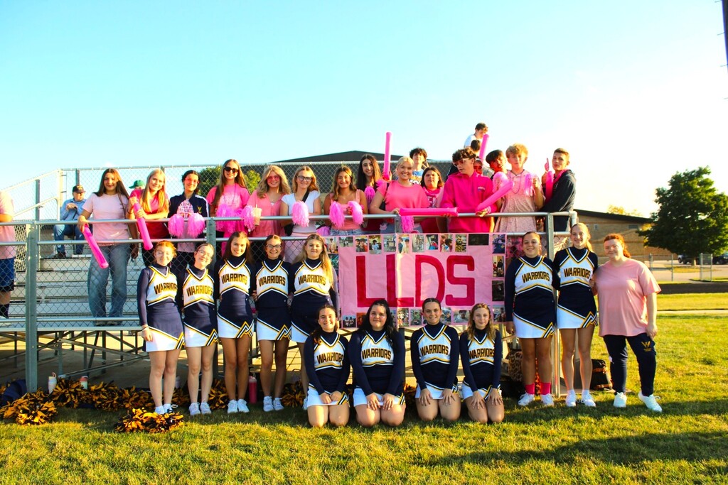 The cheerleaders and fans showing their support to the team and Dominick