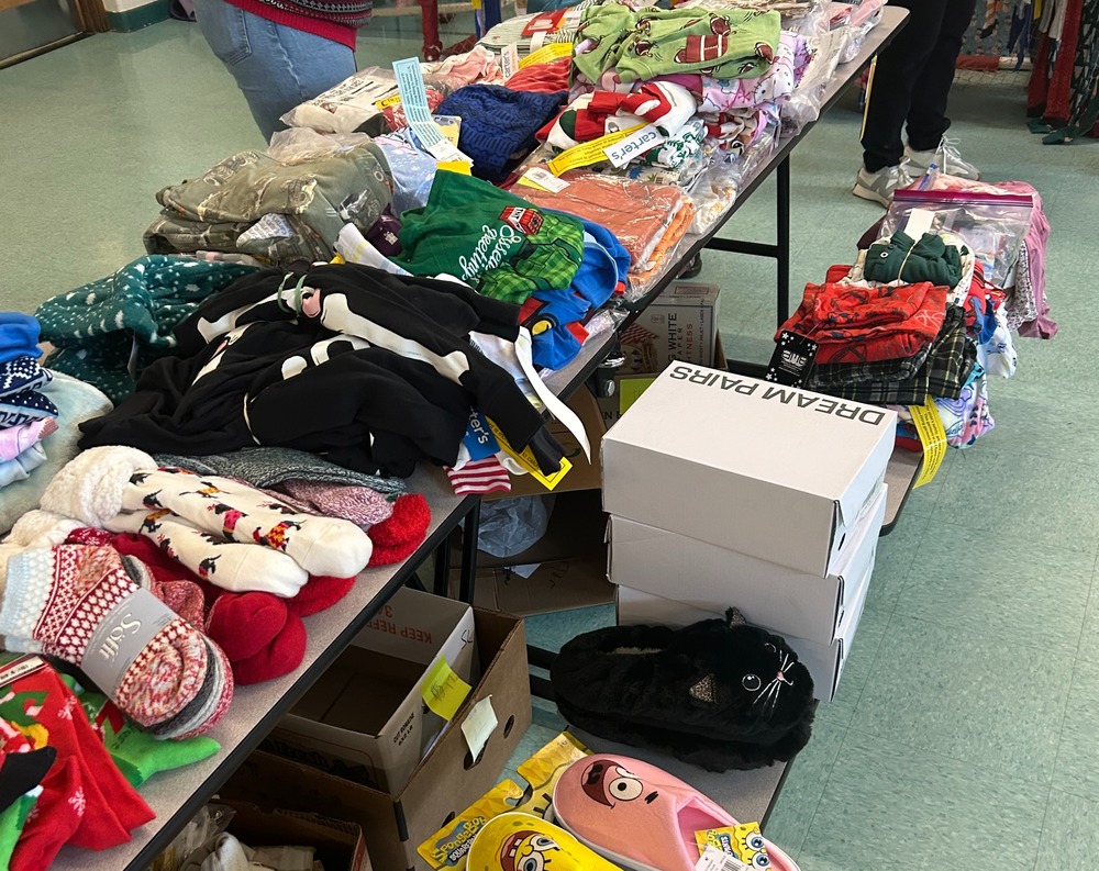 Clothes laid out on a table for giveaway