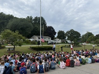 students gather outside of FPES