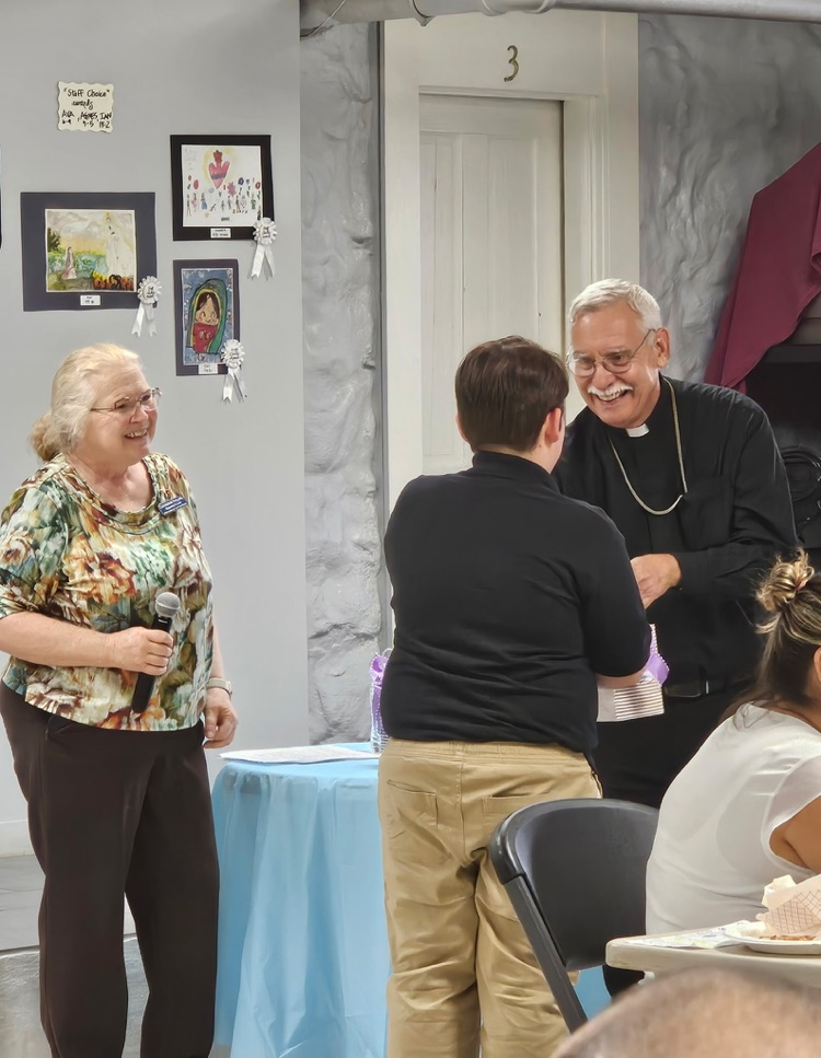 The Diocese of Little Rock started October with a celebration for Respect Life Mass. Afterwards the art contest winners were honored. Our own Logan Haworth won the Bishop's Award. His picture was picked by Bishop Taylor from over 200 entries.