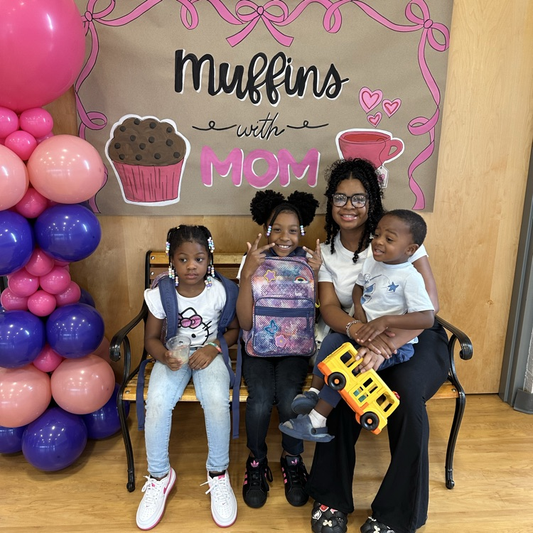 mother and her kids posing